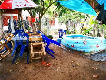 Chairs and table in yard against building