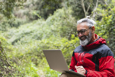 Portrait of man using mobile phone