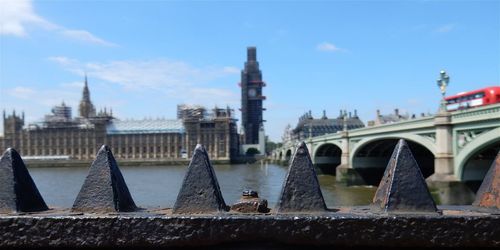 View of bridge and buildings against sky