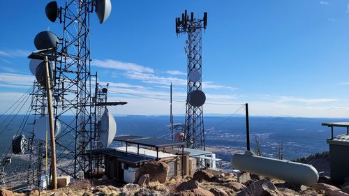 View of communications tower against cloudy sky