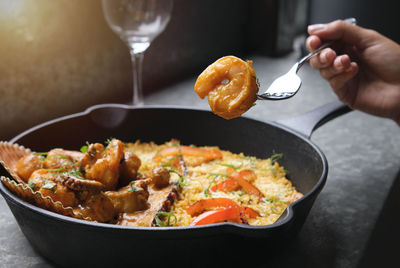 Cropped hand preparing food