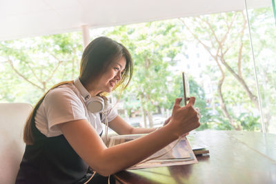 Young woman using mobile phone