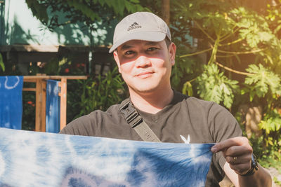 Portrait of a smiling young man outdoors