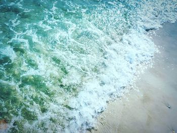 High angle view of waves splashing in sea