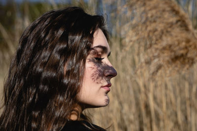 Portrait of young woman looking away