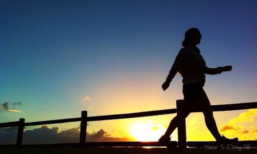 Silhouette of people at sunset