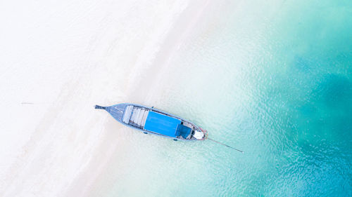 Aerial view of boat moored at beach