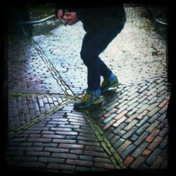 Woman standing on sidewalk