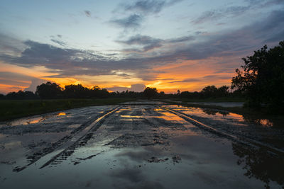 Scenic view of road against sky during sunset