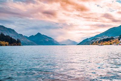 Scenic view of lake against sky during sunset