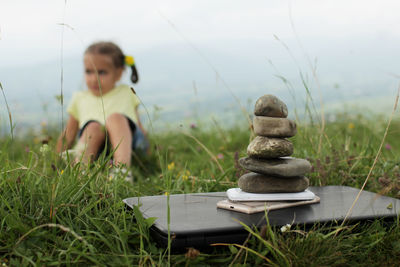 Portrait of young woman sitting on grass