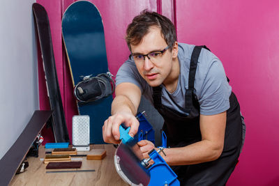 Side view of man working in gym