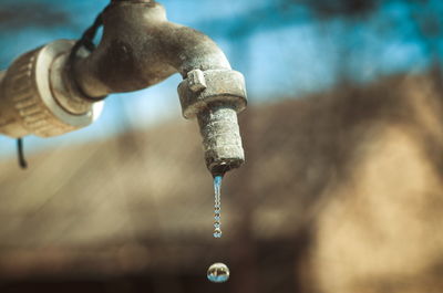 Close-up of water falling from faucet