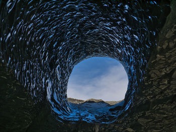 High angle view of sea seen through rocks