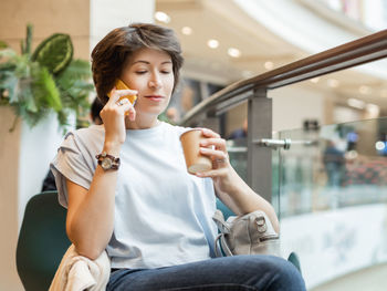 Young woman using mobile phone