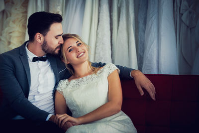 Young couple sitting in a room