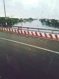 Road seen through glass window