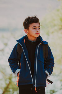 Portrait of young man standing outdoors