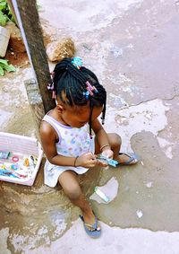 High angle view of woman sitting in water