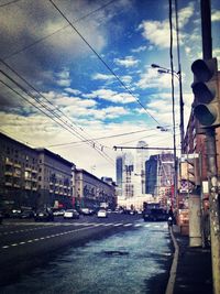 City street against cloudy sky