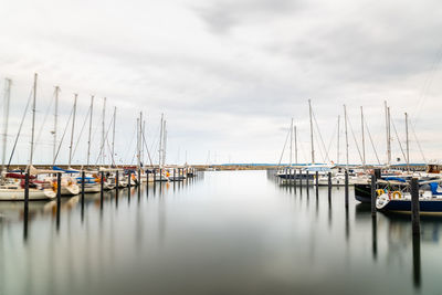 Long exposure sailing boats moored in the harbour. sassnitz is a small town located in rugen island