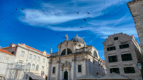 Low angle view of church of saint blaise in dubrovnik against blue sky