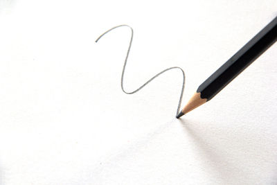 High angle view of paper on table against white background