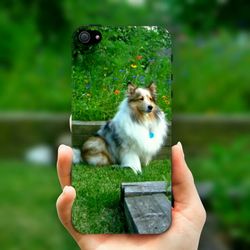 Cropped image of person holding grass