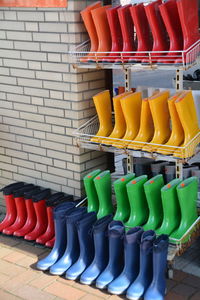Multi colored rubber boot on rack