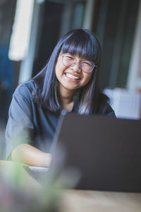 Young woman using mobile phone