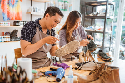 Side view of couple sitting at restaurant