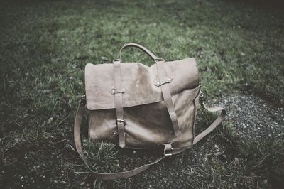 High angle view of brown bag on grassy field