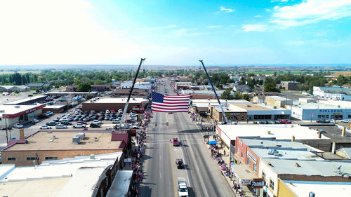 High angle view of american flag on street amidst buildings in city