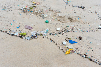 Garbage on sand at beach