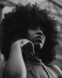 Portrait of young woman looking away outdoors