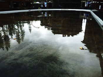 Reflection of building in puddle