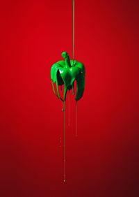 Close-up of red bell pepper against wall