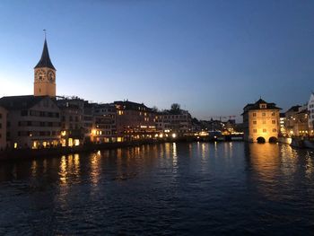 Illuminated buildings at waterfront