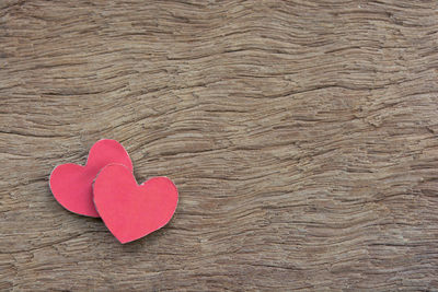 High angle view of red heart shape on table