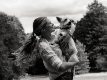 Rear view of woman with dog