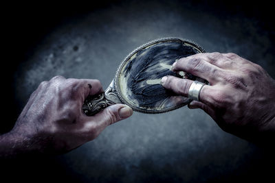 Close-up of man holding hands