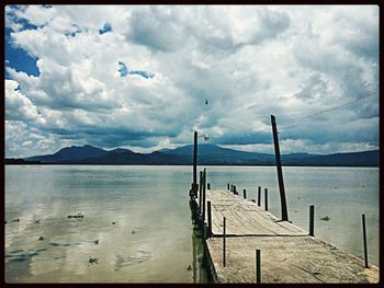 Scenic view of sea against cloudy sky