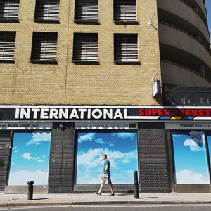 Man walking by building in city