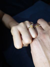 Close-up of couple holding hands