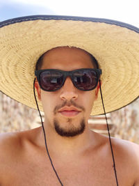 Portrait of young man wearing sunglasses