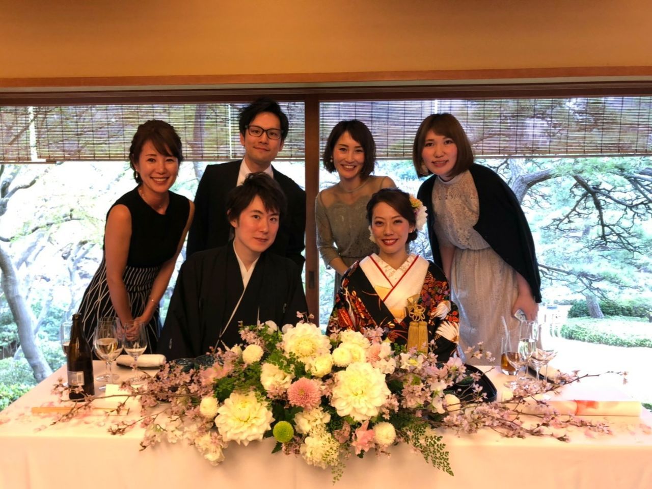 group of people, portrait, looking at camera, smiling, young adult, togetherness, young women, women, adult, front view, girls, child, people, indoors, flower, mother, flowering plant, females, standing, sister, daughter