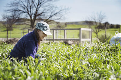 Young woman working at community garden