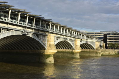 Bridge over river against sky