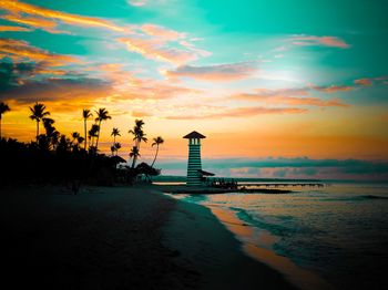 View of sea against cloudy sky during sunset