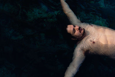 High angle view of man swimming in sea